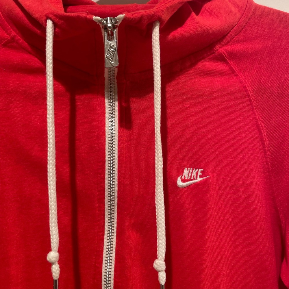 this red nike zip up hoodie